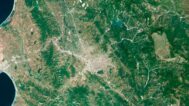 Decorative piece featuring an albania satellite map of natural landscapes.