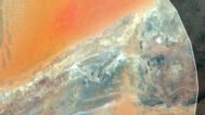 Decorative piece featuring a satellite map of Algeria’s natural landscapes.