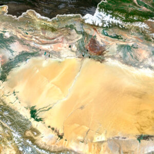 Satellite view of China highlighting the Himalayan mountains and vast plains.