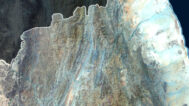 Satellite view of Eritrea highlighting coastal plains and mountainous regions.