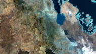 Decorative piece featuring an Eritrea satellite map of natural landscapes.