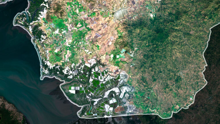 Decorative piece featuring a satellite map of Honduras’s natural landscapes.