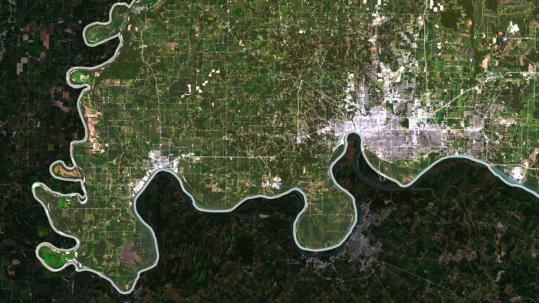 Decorative piece featuring a satellite view of indiana’s natural and urban landscapes.