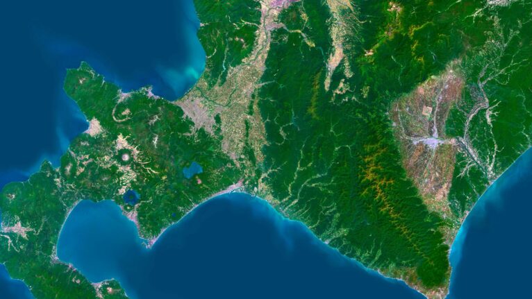 Decorative piece featuring a satellite map of Jamaica’s natural landscapes.