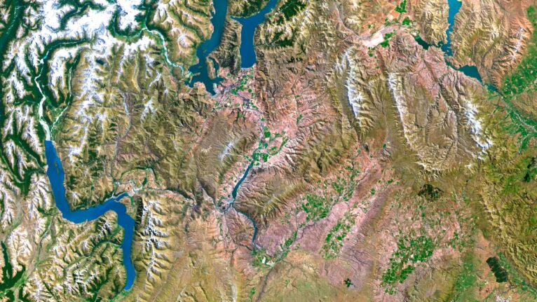 High-resolution satellite image of New Zealand’s Southern Alps, showcasing detailed elevation and topographic features.