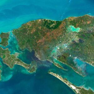 Satellite view of Sri Lanka highlighting coastal regions and lush rainforests.