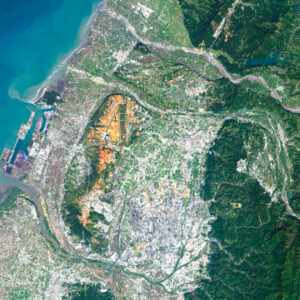 Satellite view of Taiwan highlighting lush mountains and coastal plains.