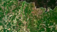Satellite view of Ukraine highlighting the Carpathian Mountains and Black Sea coast.