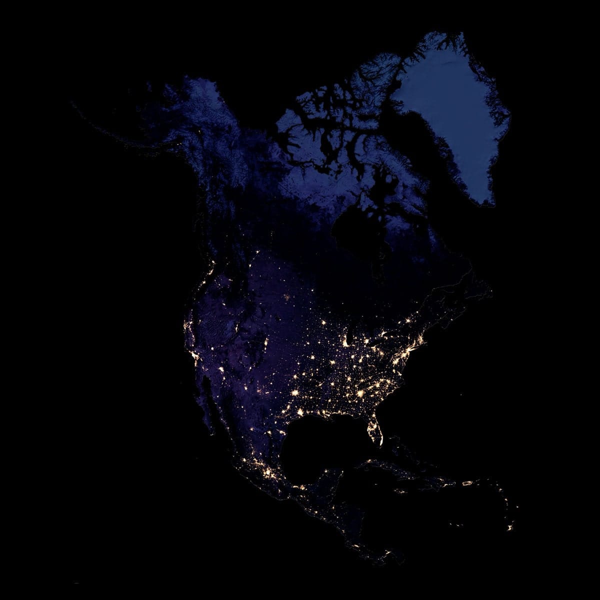 North America at Night – Full Satellite View High-resolution satellite image of North America at night, showing illuminated urban areas and coastlines.